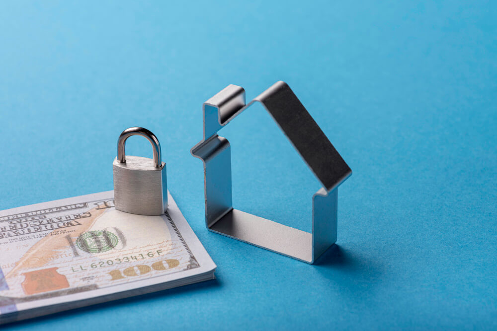 Financial security concept with padlock on top of dollar bills